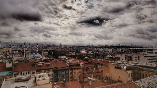 Aerial view of cityscape against sky