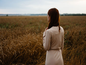 Woman standing on field