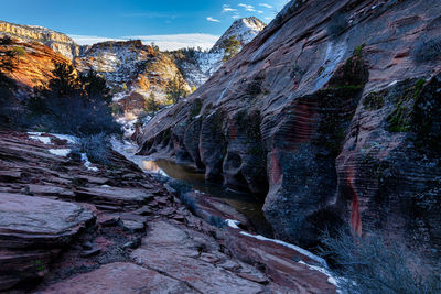 Rock formation on land against sky