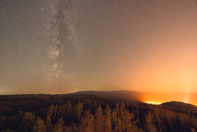 Scenic view of mountains against sky at night with milkyway above wernigerode 