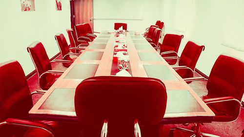 Empty chairs and tables in restaurant