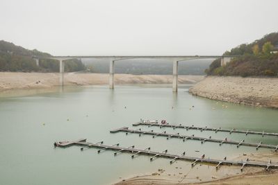 Scenic view of bridge over river against clear sky