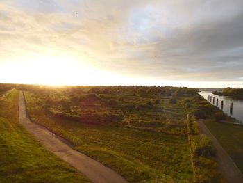 Scenic view of landscape against cloudy sky