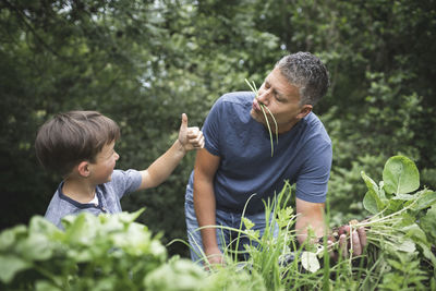 Father and son on plants