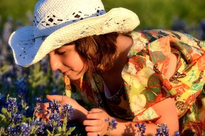 Portrait of girl smelling flowers
