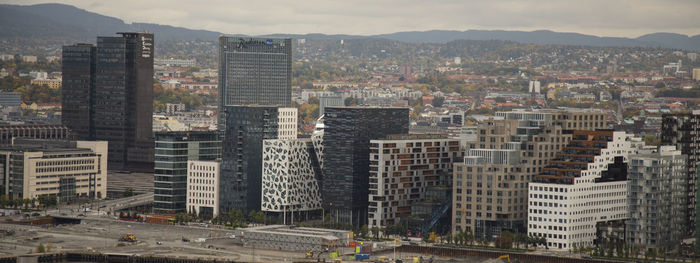 High angle view of buildings in city against sky