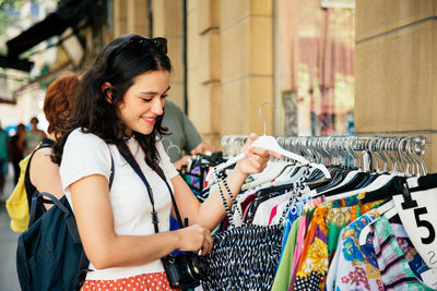 Young woman shopping at store