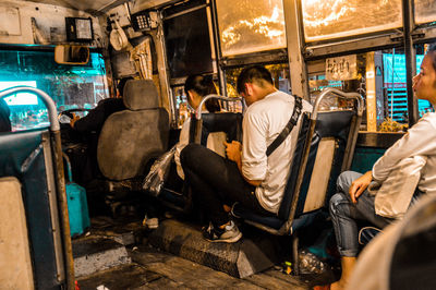 People in an obsolete bus