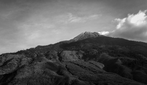 Low angle view of rock formations against sky