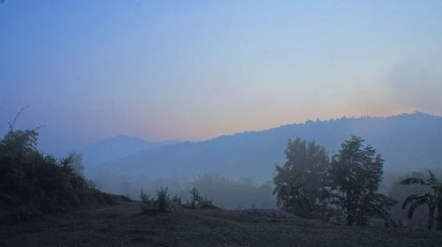 Scenic view of mountains against sky during sunset