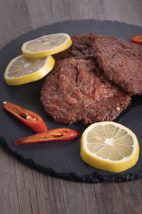 Close-up of lemon slice on table