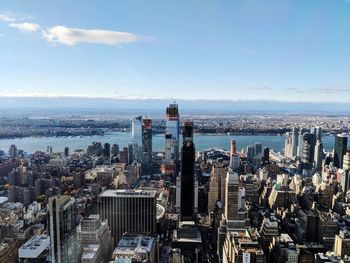 High angle view of cityscape against cloudy sky