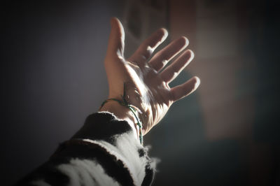 Close-up of hand against blurred background