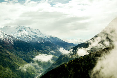 Scenic view of mountains against sky during winter