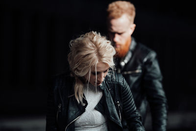 Young couple looking at camera