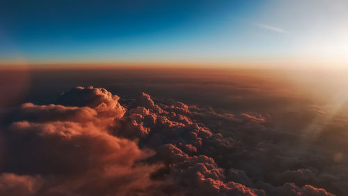 Aerial view of clouds in sky during sunset