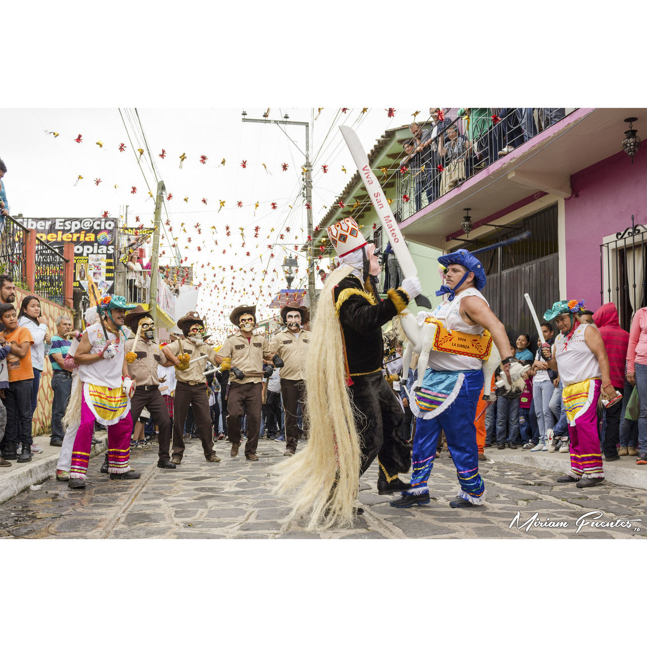 PEOPLE PLAYING IN CITY DURING FESTIVAL