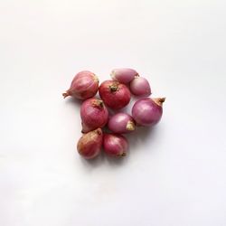 High angle view of cherries against white background