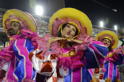 Full length of woman dancing at night