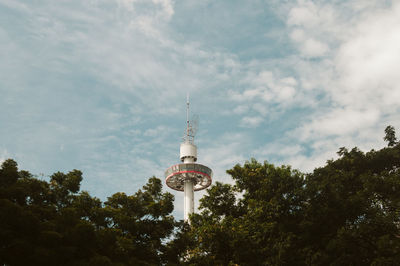 Low angle view of building against cloudy sky