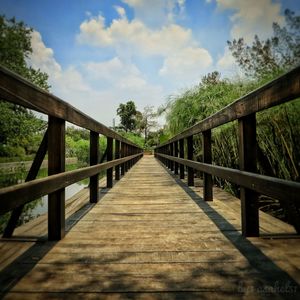 View of bridge against cloudy sky