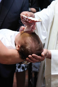 Close-up of baby holding hands