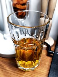 Close-up of whiskey in glass on table