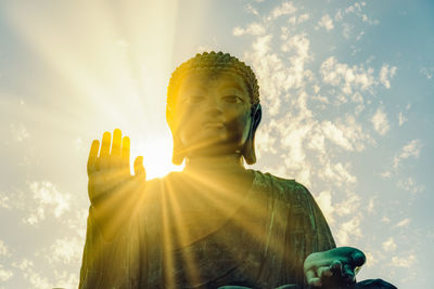 Low angle view of statue against sky