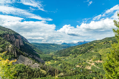 Scenic view of mountains against cloudy sky