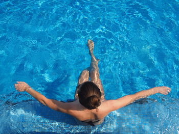 Woman swimming in pool
