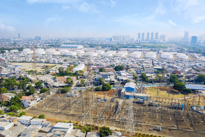 High angle view of city buildings against sky