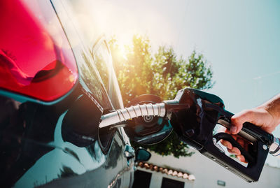 Cropped hand of man holding car