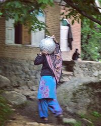 Rear view of a girl walking outdoors