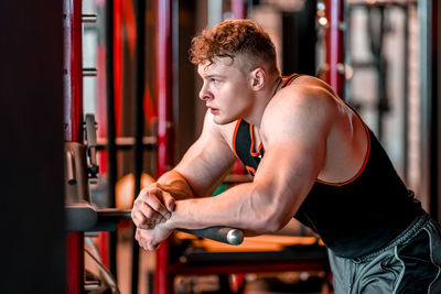 Young woman exercising in gym