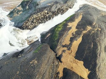 High angle view of rocks in sea