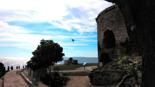 Scenic view of sea against cloudy sky