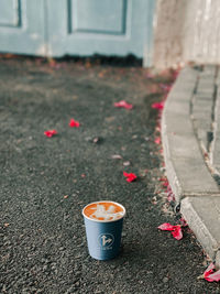 Coffee cup on footpath