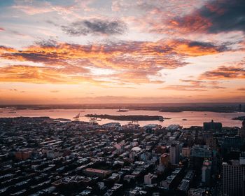 High angle view of buildings against sky during sunset