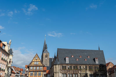 Buildings in city against sky