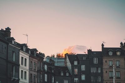 Low angle view of buildings at sunset