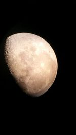 Low angle view of moon against sky at night