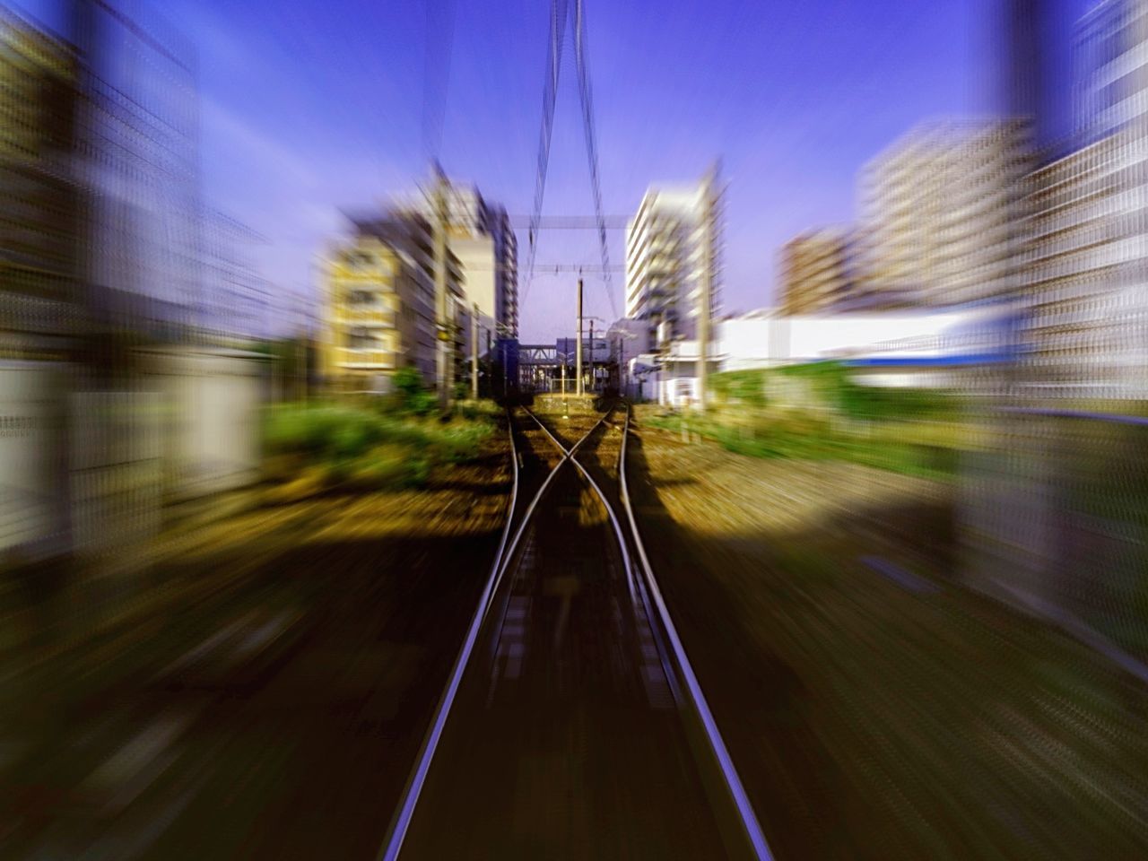 transportation, railroad track, speed, blurred motion, long exposure, motion, light trail, rail transportation, the way forward, illuminated, public transportation, built structure, on the move, diminishing perspective, city, travel, architecture, sky, vanishing point, railroad station platform