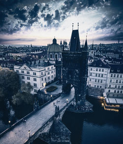High angle aerial view of charles bridge in prague against cloudy sky at the sunrise