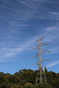 Low angle view of electricity pylon against sky