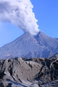 Smoke emitting from volcanic mountain