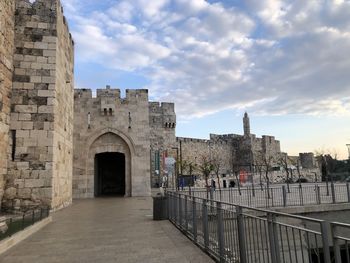 View of historic building against cloudy sky