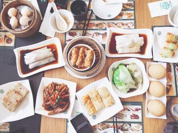 High angle view of various food served on table