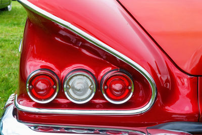 Tail lights and a wing on old classic american car