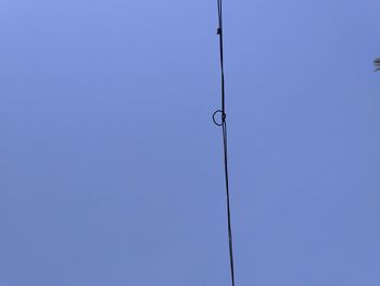 Low angle view of street light against clear blue sky