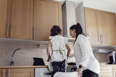 Mother and daughter in kitchen